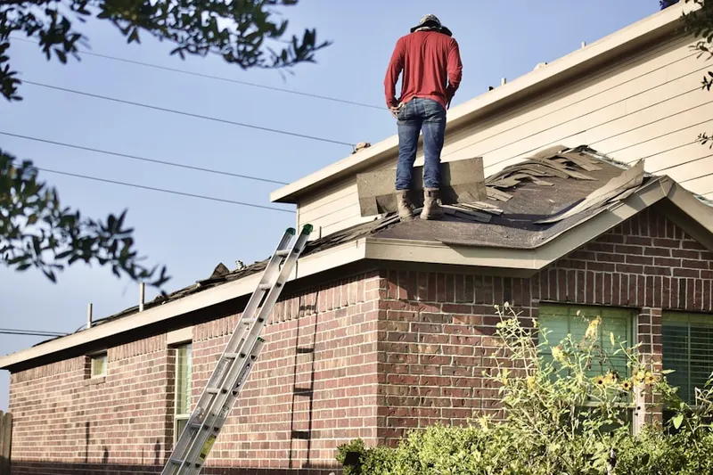 Professional roofer working on a residential roof in Del Rey